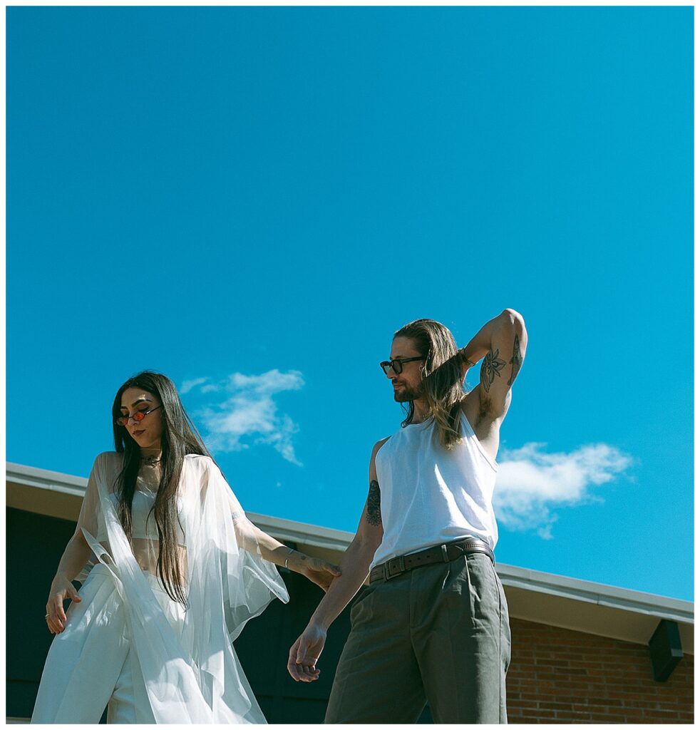 outdoor engagement photos blue skies