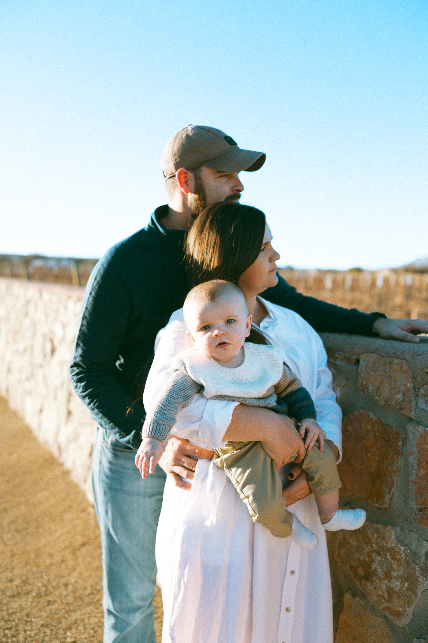 editorial family photo overlooking a vineyard in